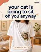 Cat sitting in the built-in front pouch of the white Averello tee